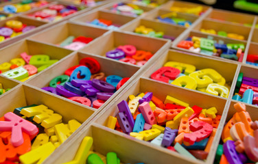 plastic multicoloured alphabet in the box ready for create idea