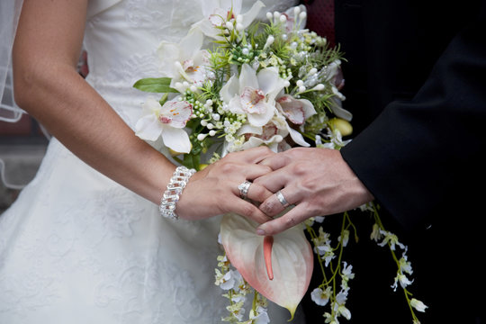 holding bridal bouquet