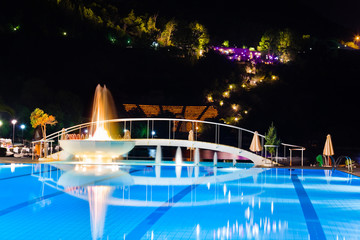 Water pool and fountain at night