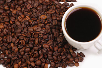 Cup with coffee. costing on coffee grain