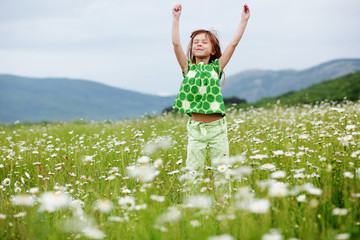 Child at camomile field