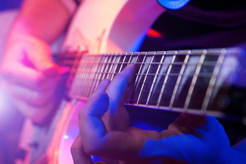 Obraz premium young male musician with a white guitar