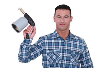 Man showing blowtorch on white background