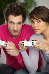 Man and woman playing video games