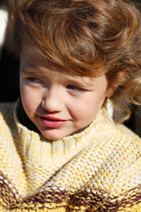 Little girl wearing knitted jumper