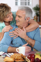 Mature couple having breakfast