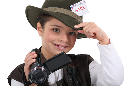 Little boy dressed as reporter