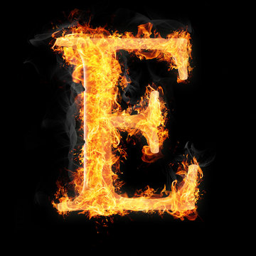 Fonts and symbols in fire on black background - E