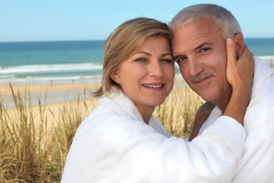 A cute middle age couple at the beach.