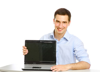 A young guy showing a laptop