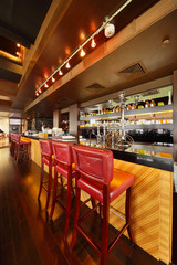 bar counter with chairs in empty comfortable restaurant