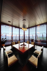 square table in deepening of floor and chairs in restaurant