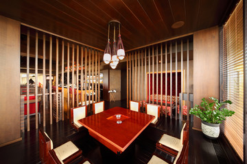 table in deepening of floor and chairs in restaurant