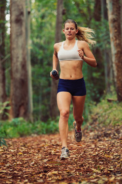 Woman Running Outdoors in Forest