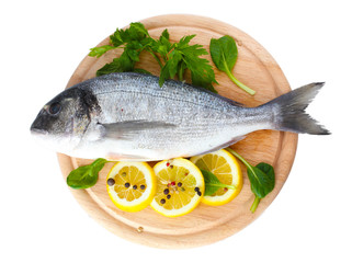 Fresh fish with lemon, parsley and spice