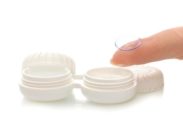 contact lens on finger and case isolated on white