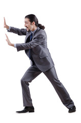 Obraz premium Businessman pushing away virtual obstacles