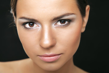 Obraz premium A portrait of a beautiful woman isolated on black background