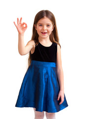 cute six year old girl with thumbs up, isolated against white ba