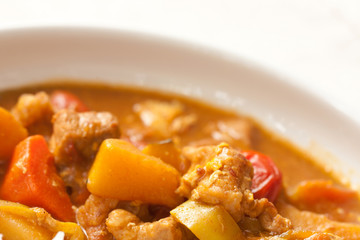 Delicious pork curry served with hot Thai jasmine rice