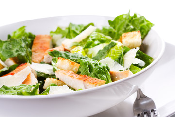 Caesar salad with chicken and greens