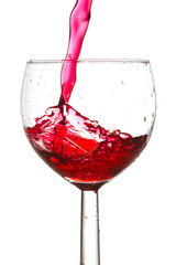 red wine pouring into glass