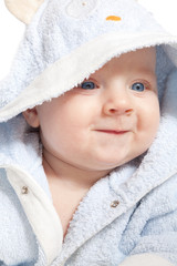 portrait of a cheerful child in blue bathrobe