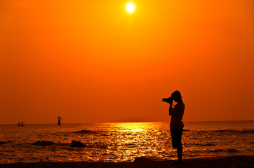Photographer with sillouette on Hua Hin Beach