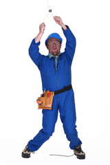 Electrician receiving an electric shock