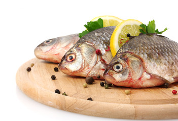 Fresh fishes with lemon, parsley and spice