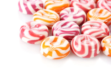 striped fruit candies isolated on white