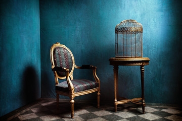 Louis table, armchair and old golden bird cage