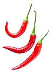 3 red peppers in different shapes and sizes