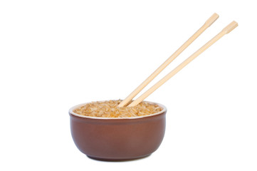 Plate of rice and chopsticks.