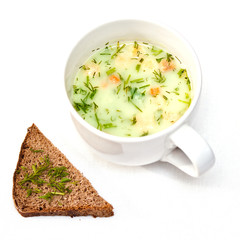 a cup of instant soup and a slice of bread