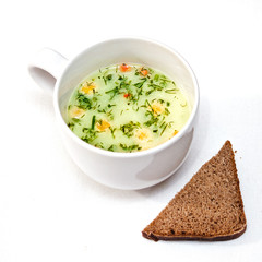 a cup of instant soup and a slice of bread