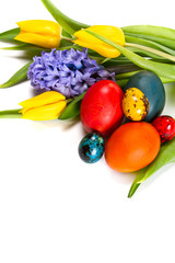 Colorful painted easter eggs with spring flowers