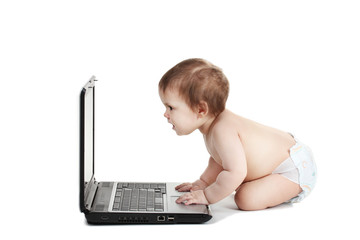 Cute baby girl and laptop isolated on white