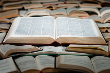 Big book on heap of books