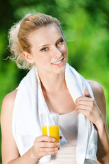 Woman drinking juice after exercise