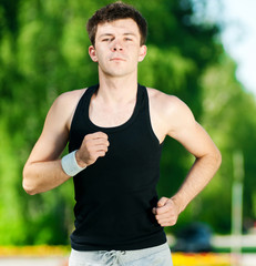Young man jogging in park