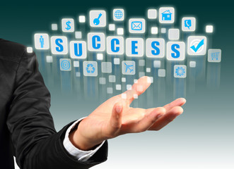 Obraz premium Businessman hand holding with success alphabet streaming images