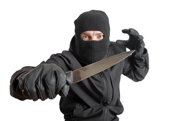 Masked criminal holding a knife, isolated on white