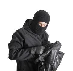 Masked criminal holding a stolen handbag, isolated on white