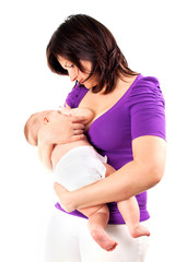 Young mother feeding her little baby with breast