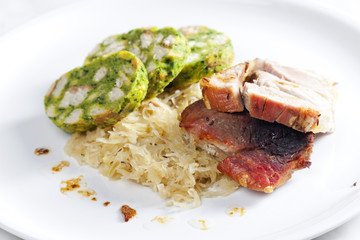 pork meat with herbal dumplings and cabbage