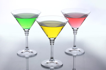 alcoholic cocktails on table isolated on white
