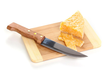 Cheese on cutting board with knife isolated on white