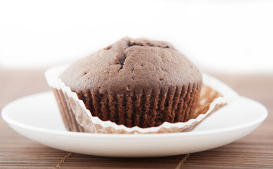 chocolate muffins close up in white plate