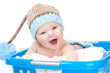 little baby in laundry basket